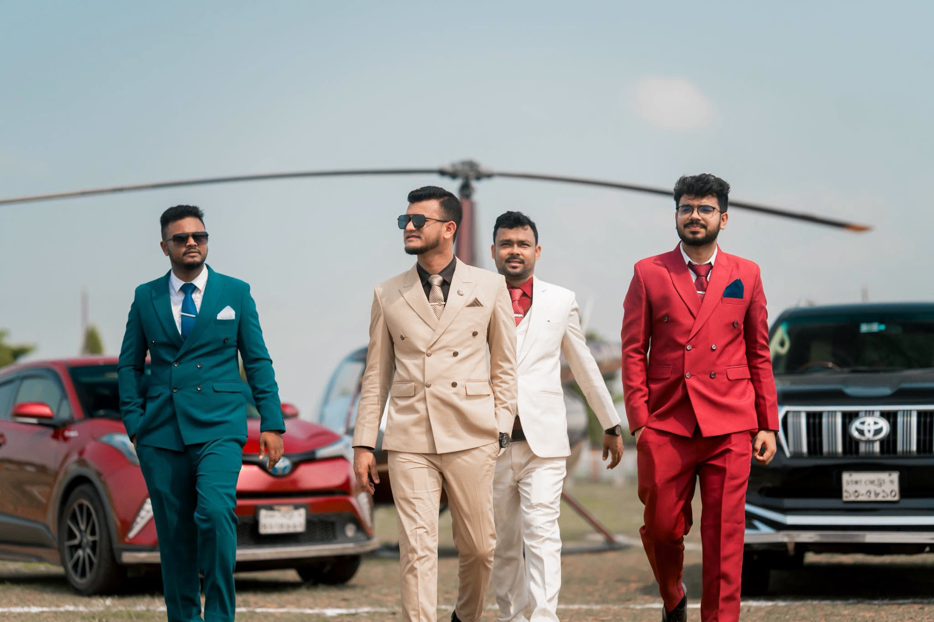 Nerob Pikash walking with business associates in formal attire